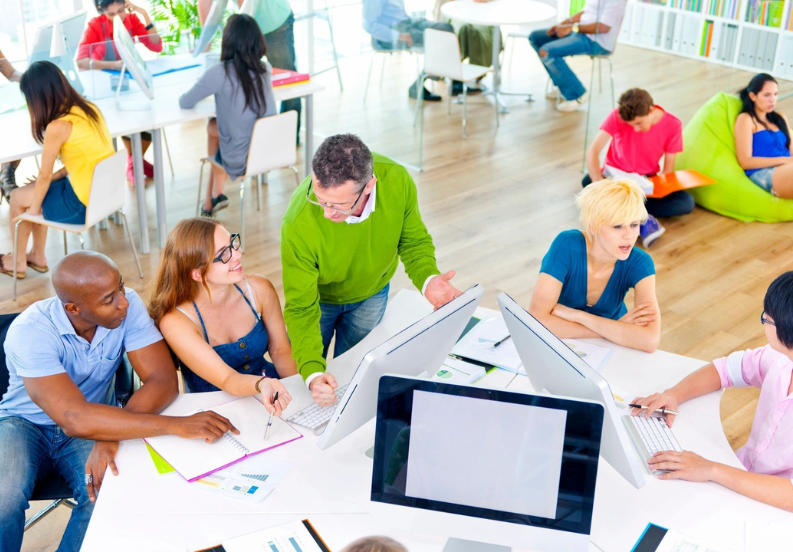 A group of people sitting around a table.