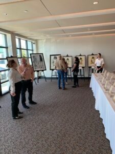 People viewing art in a gallery room.