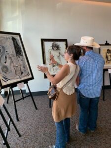Couple admiring art in a gallery.