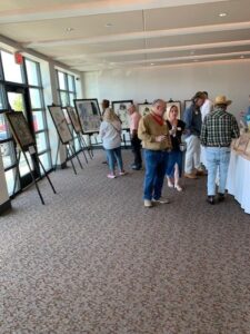 People viewing art in a gallery exhibition.