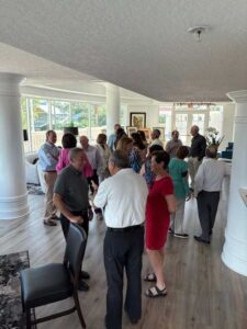 Group of people socializing in a room.