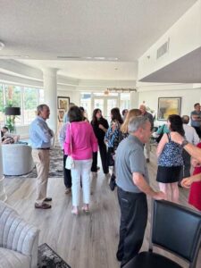 People socializing at a gathering in lounge.