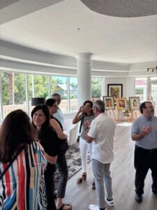 People socializing at an art gallery event.