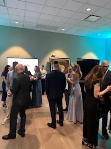 People mingling at a formal event.